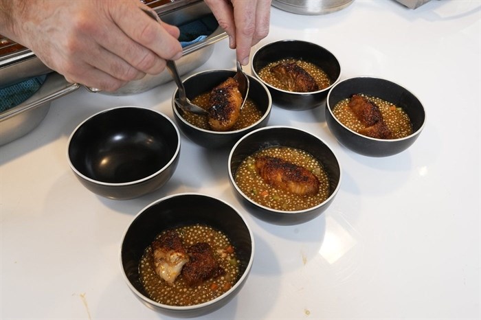 Fish dishes, prepared by 3-star chef Alexandre Mazzia, are presented Tuesday, April 30, 2024 in Paris. Some 40,000 meals will be served each day during the Games to over 15,000 athletes housed at the Olympic village. 