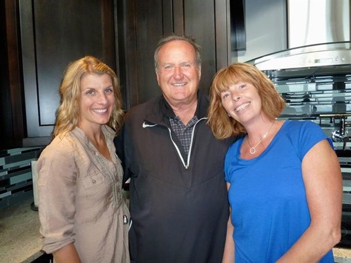 A picture from Fortune Marketing's Facebook page showing Osoyoos mayor Stu Wells, centre, and his wife Dr. Martha Collins, right, taken at an Osoyoos Mountain Estates open house.