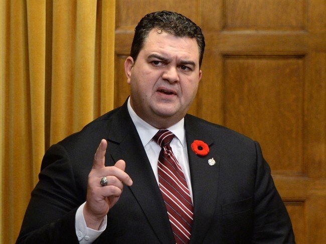 Dean Del Mastro reads his resignation statement in the House of Commons on Parliament Hill in Ottawa on Wednesday, Nov. 5, 2014. 