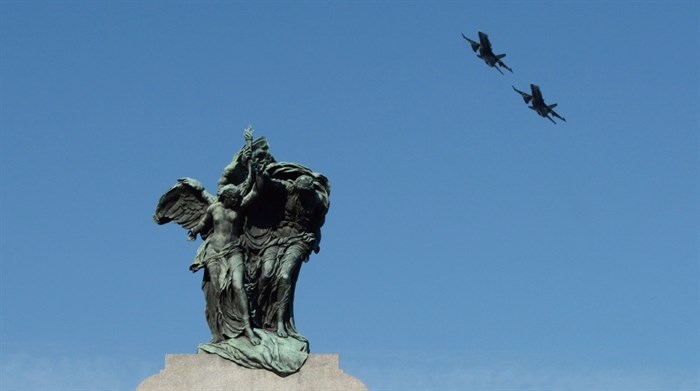 CF-18 jets fly over the National War Memorial during the Remembrance Day ceremony in Ottawa on Tuesday, Nov. 11, 2014.