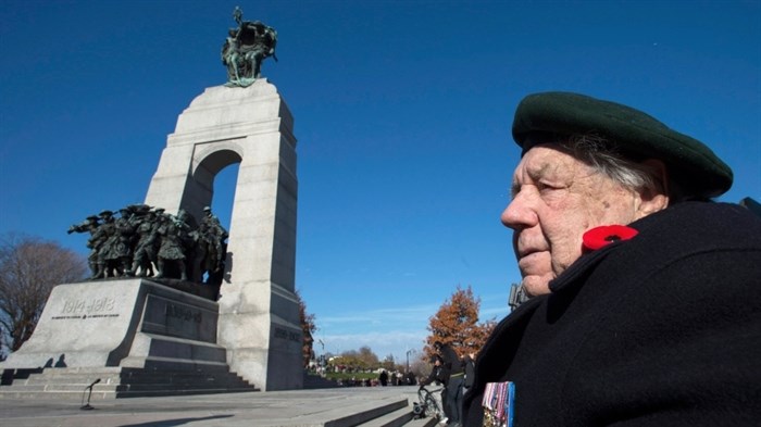 Second World War veteran Ted Patrick looks on before the start of the Remembrance Day ceremony at the National War Memorial in Ottawa on Tuesday, Nov. 11, 2014.