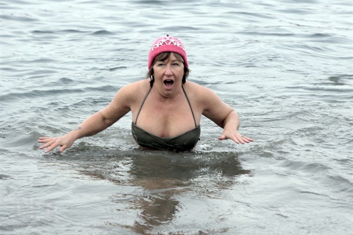Linda Gayfer, one of the Kamloops Polar Bear Swim organizers, jumped into the South Thompson River with the other 50 participants, Thursday, Jan. 1, 2015.