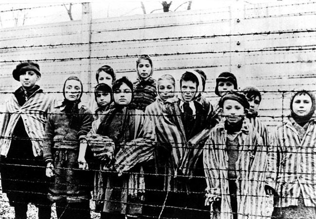 A photo taken just after the liberation by the Soviet army shows a group of children wearing concentration camp uniforms at the Auschwitz Nazi concentration camp on January 27, 1945. Miriam Friedman Ziegler, nine-years-old at the time, is second from left. Friedman Ziegler, who lives in Thornhill, Ont., is among about 100 survivors who are returning to Poland this week to commemorate the 70th anniversary of the liberation of Auschwitz. 