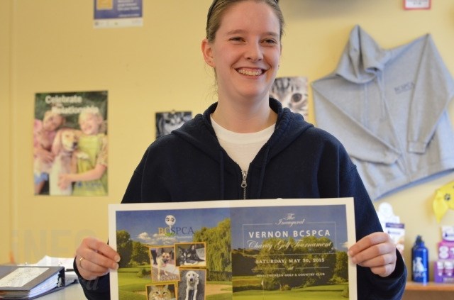 Vernon branch manager Chelsea Taylor holds a poster for the upcoming Vernon B.C. SPCA Charity Golf Tournament in May. 