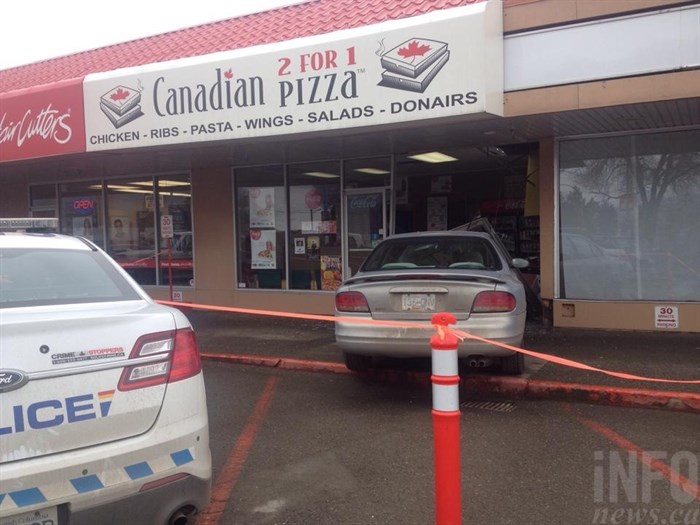 A car jumped the sidewalk and crashed through a storefront at 700 Tranquille Road in Kamloops, February 10, 2015.