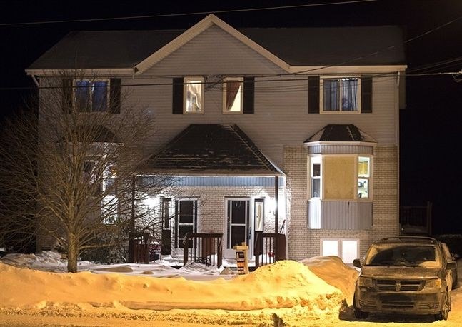 A house is seen on Tiger Maple Drive in Timberlea, N.S, a Halifax suburb, where police found a deceased person early Friday, Feb. 13, 2015. RCMP issued a statement on saying the 19-year-old man who was found dead had intentions go to a public place with a woman and open fire on citizens before killing themselves on Valentine's Day. Three people have been arrested. 
