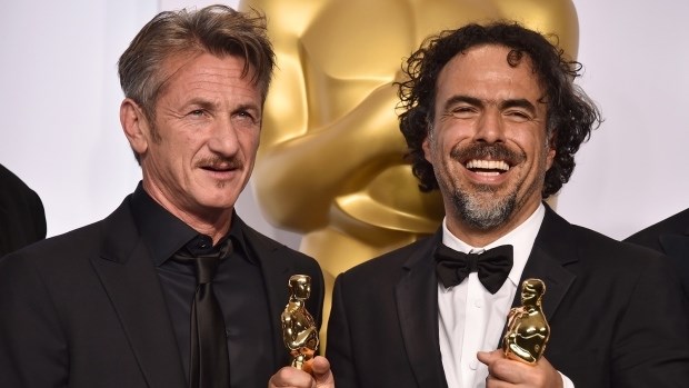Sean Penn, left, and filmmaker Alejandro Iñárritu pose in the press room at the Academy Awards, on Feb. 22, 2015.