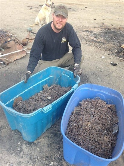 Calvin Fedechko shows all the nails collected at the site.
