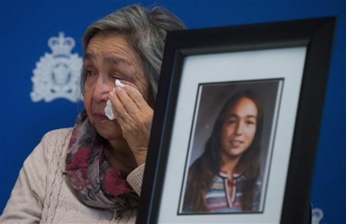 Madeline Lanaro, whose daughter Monica Jack was 12-years-old when she was murdered in 1978 near Merritt, B.C., wipes away tears after the RCMP announced an arrest in connection to her murder and that of Kathryn-Mary Herbert, during a news conference in Surrey, B.C., on Monday December 1, 2014.