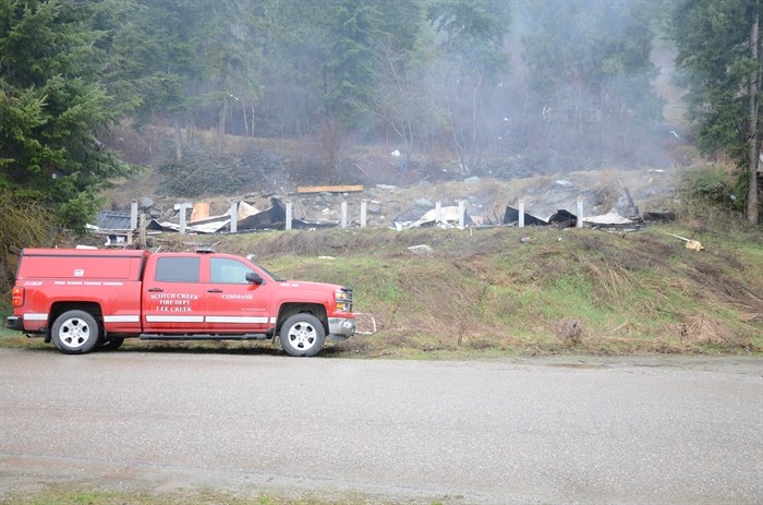 The morning after a fire burned an abandoned mobile home on Butters Road in Scotch Creek, Friday, March 20, 2015.
