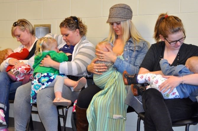 Breast-feeding mothers inside West Kelowna council chambers.