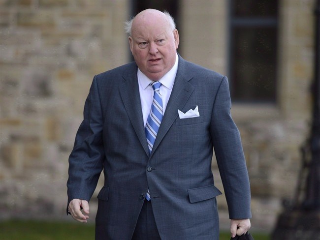 Mike Duffy is shown arriving at the Senate in Ottawa, Monday, October 28, 2013. 