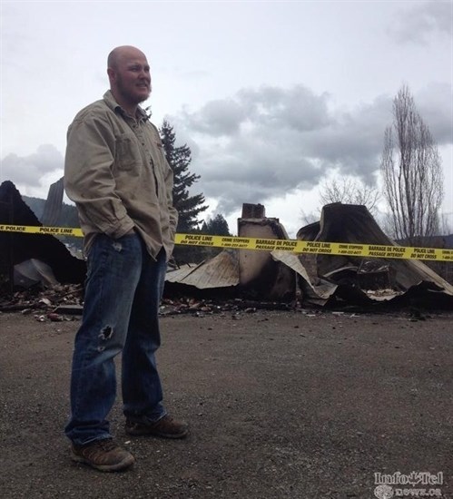 Cory George after the store burned down in 2014. 