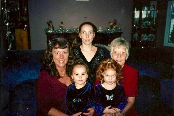 In this photo on a Go Fund Me website, Theresa Ashley Neville is pictures with her daughters and other unidentified family members.