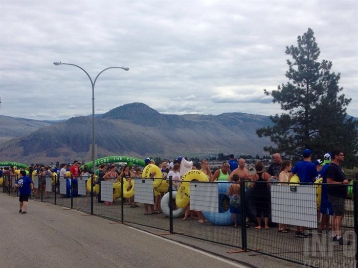 The lineups were long for the Slide the City giant slip and slide on Hillside Drive in Kamloops, Saturday, July 18, 2015.