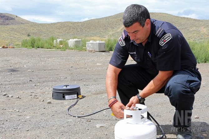 Sheldon Guertin of Kamloops Fire Rescue shows how to use properly use a propane device allowed under a campfire ban.