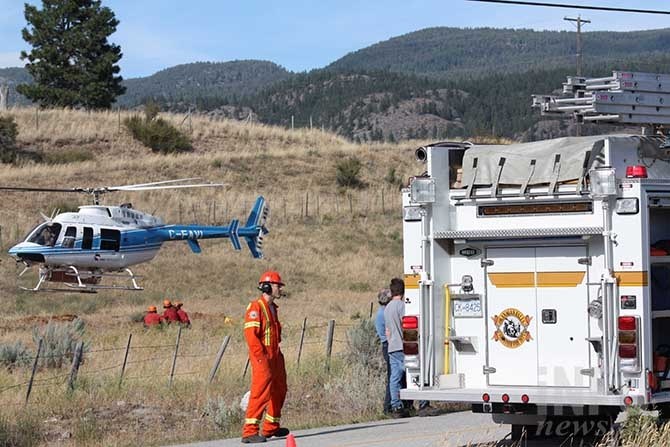 BC Wildfire crews arrive to help Okanagan Falls Volunteer Fire Department stop a wildfire on McLean Creek Road this afternoon.
