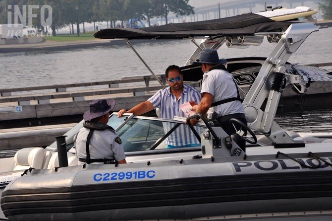 RCMP reserve constables Randy Ferris and Phil Boissonault of the marine enforcement unit give out a warning to a boater.
