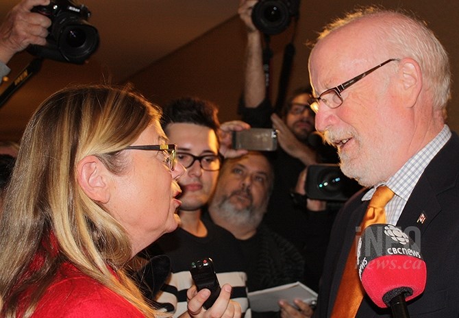 Liberal candidate Connie Denesiuk congratulates NDP candidate Richard Cannings following his victory at the polls, Monday, Oct. 19.