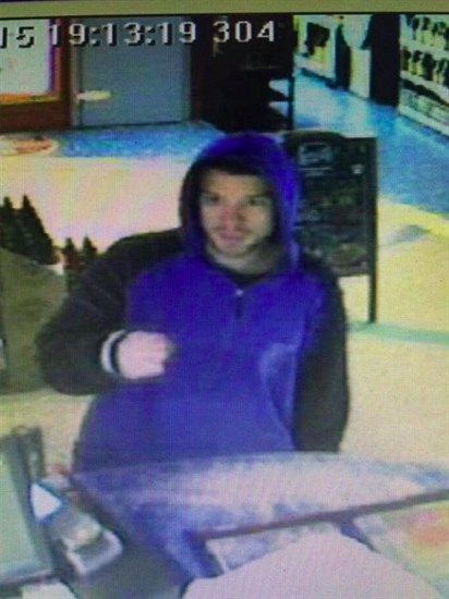 Police are looking for this man in connection with the poppy donation theft at Bosley's, and the theft of a tip cup at Kalamalka Wine and Spirits the same night. 
