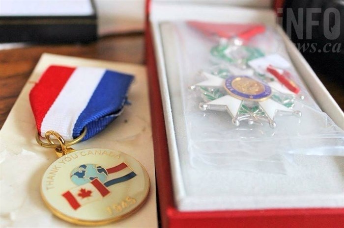 The recently received medal from France is still packaged from its delivery last month. Ford keeps it close to a similar medal from Holland as a thank you for the liberation.