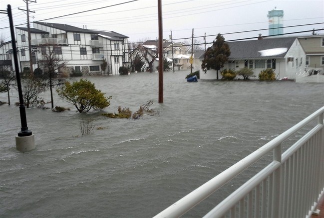 Coastal flooding from a winter snowstorm inundates houses along New York Avenue, Saturday, Jan. 23, 2016, in North Wildwood, N.J.