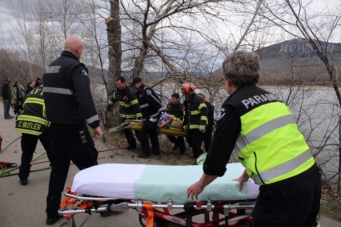 A man rescued from the shore of the North Thompson River was wrapped in blankets and pulled up the embankment this afternoon, March 9, 2016.