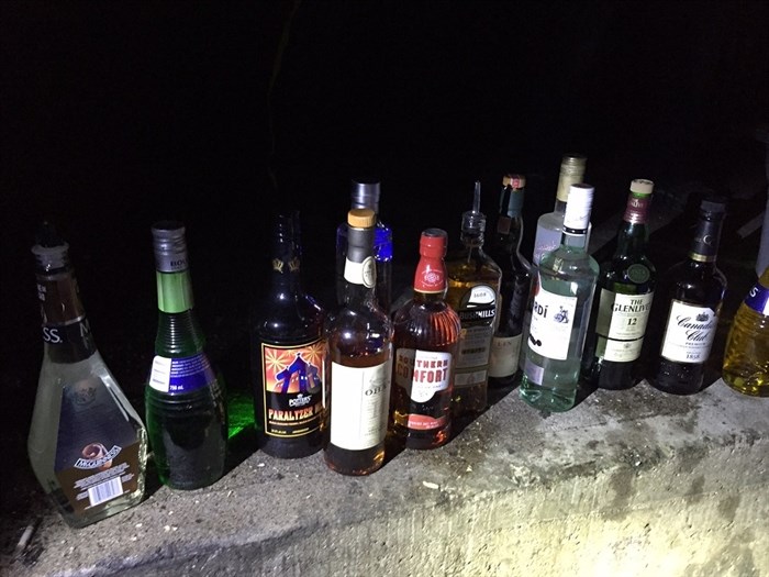 Pictured are the bottles of liquor recovered by RCMP following a break, enter and theft at the Barley Mill Brew Pub in Penticton, Friday, April 22, 2016.