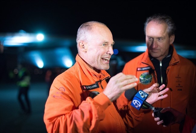 Solar Impulse 2 pilots Bertrand Piccard, left, and Andre Borschberg speak with reporters after their solar-powered plane landed at Moffett field in Mountain View, Calif., on Saturday, April 23, 2016.