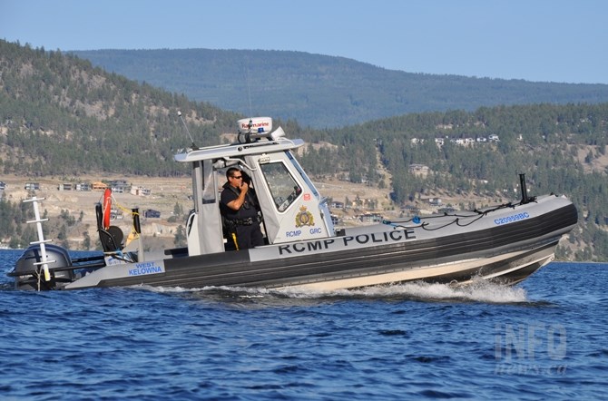 The RCMP boat from West Kelowna was called in to clear the fire area of boats so water bombers could work safely.