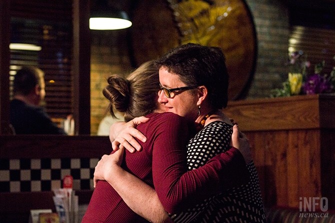 NDP candidate for the Kamloops-South Thompson, Nancy Bepple, hugs a supporter at an event after conceding to Todd Stone.