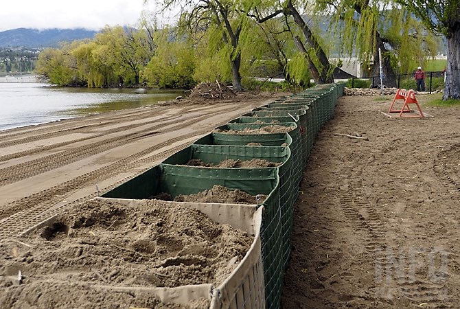 FILE PHOTO - Square baskets filled with sand are set up at the Lake Avenue Beach access in Kelowna, May 16, 2017.