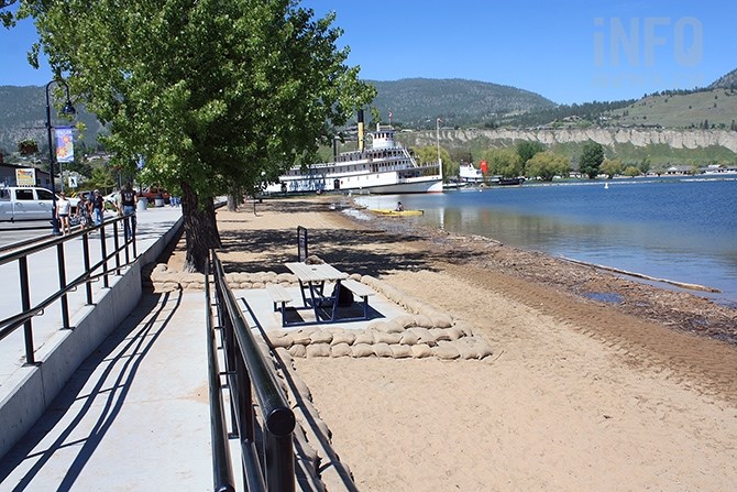A steadily disappearing Okanagan Lake beach is bolstered at access points with sandbags as of Tuesday afternoon, May 23, 2017.