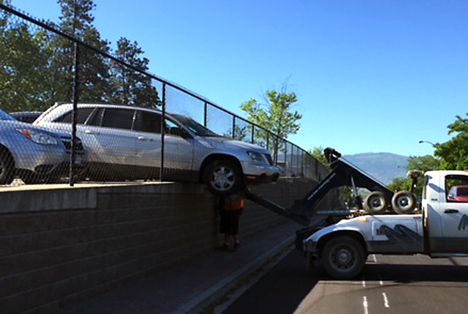 Car hangs off ledge in Kelowna - InfoNews.ca - InfoTel.ca - InfoTel News Ltd
