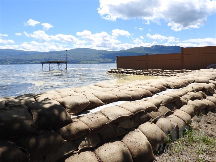 The rising water in Okanagan Lake continues to threaten the  sandbag wall surrounding Green Bay in West Kelowna, Friday, June 2, 2017.