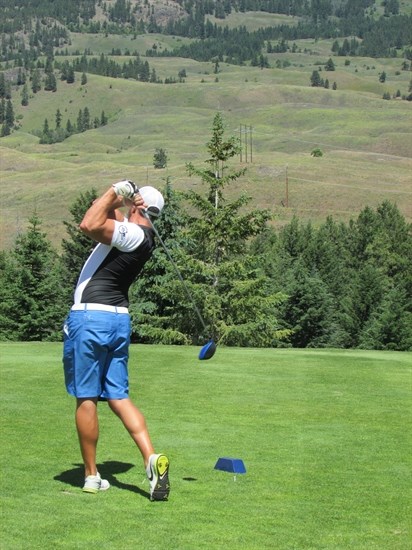 Brian Froese sends his ball down the Fairway during the Cops for Kids Charity Golf Tournament at Black Mountain Golf Club in Kelowna.