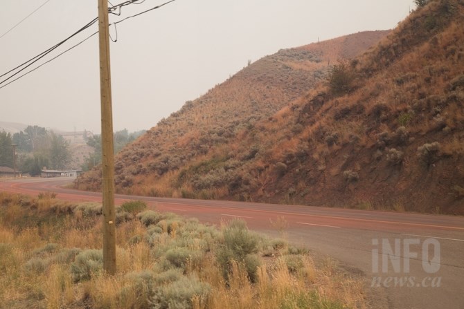 FILE PHOTO - Large areas of the sagebrush are covered in fire retardant in Cache Creek, July 11, 2017.