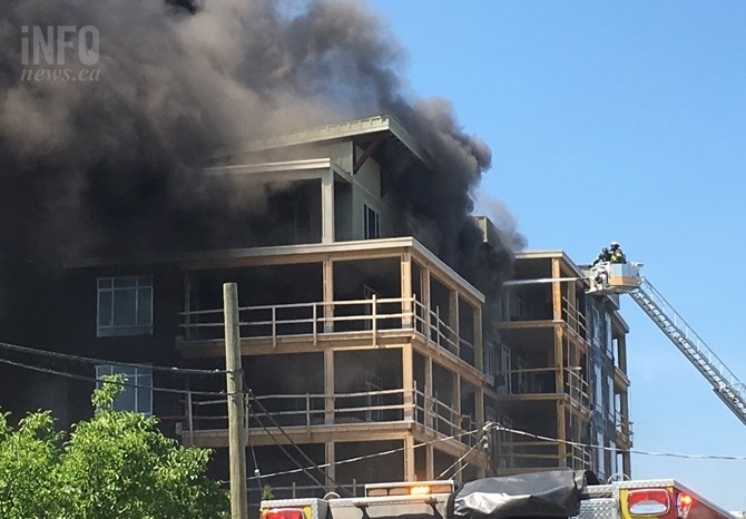 Kelowna firefighters had to rescue four of their own members who became trapped on the balcony of a condo building that caught fire July 8, 2017.