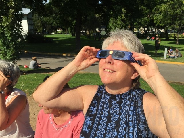 Science teacher Annette Toop gazes up at the eclipse. 