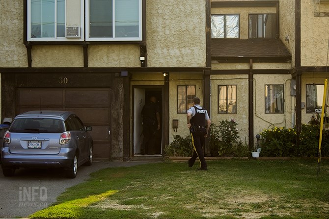 RCMP officers at a home on Cambridge Crescent in Kamloops where a potential incendiary device was found, Tuesday, Aug. 29, 2017.