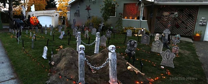 Bones litter the ground near a recently dug grave in a Halloween display at 182 Waddington Drive in Kamloops.