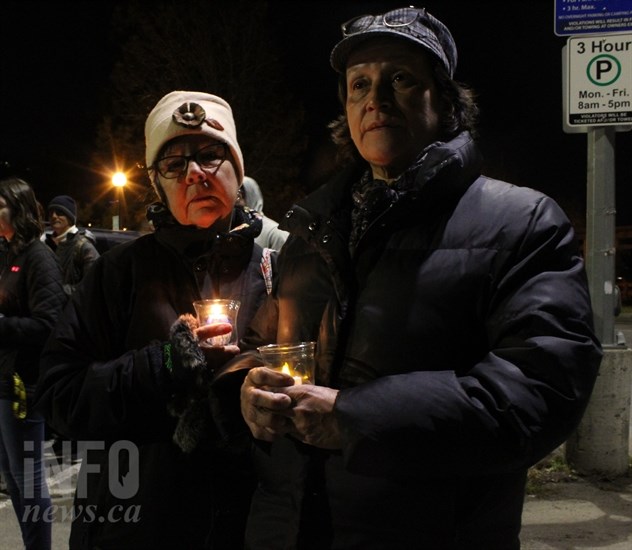 Kamloops Aboriginal Friendship Society addictions counsellor Dee Howse stands with Karen Jules holding candles before the walk for sobriety begins on Wednesday, Nov. 28, 2018.