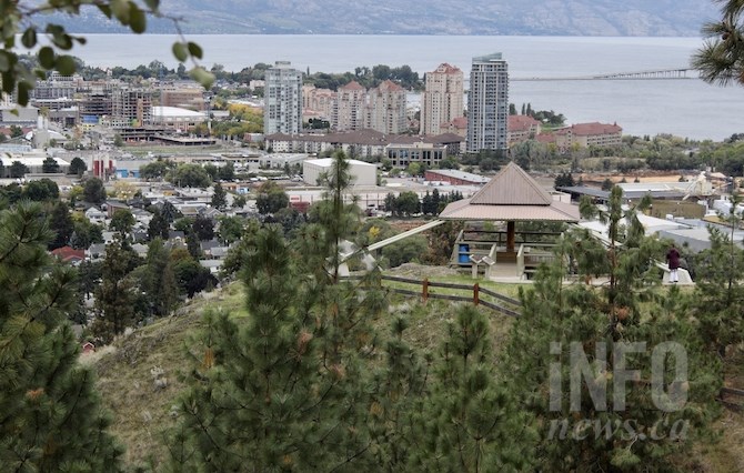 Trees frame the lower pavilion with the city and Okanagan Lake in the background.