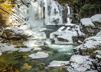 Crazy Creek Falls in Malakwa tumbles through snow covered rocks. 