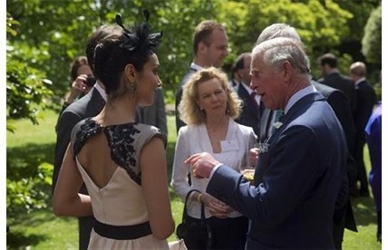 Britain's Prince Charles chats with Ta Canadian dancer with the Royal Ballet during a reception at St James's Palace in London, Wednesday, May 14, 2014.