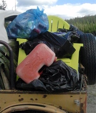 One of several loads of garbage taken from the site that was trashed by partiers over the weekend.