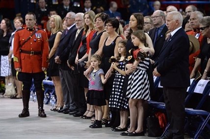 The family of Const. Douglas James Larche attend the RCMP regimental funeral for three slain RCMP officers in Moncton on Tuesday, June 10, 2014.