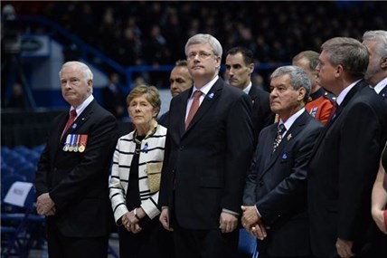 Governor General David Johnston (left to right) and wife Sharon, Prime Minister Stephen Harper, N.B. Lt. Gov. Graydon Nicholas and Quebec Premier Philippe Couillard wait for the start of the RCMP regimental funeral on Tuesday, June 10, 2014 for the three RCMP officers who were gunned down in Moncton last week.