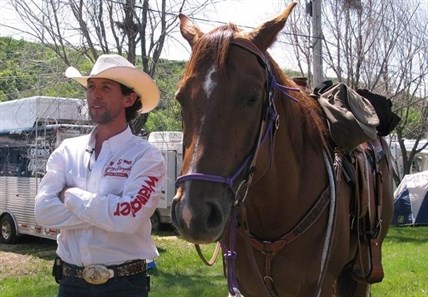Filipe Masetti Leite speaks to a reporter before riding out of the Stampede grounds in Calgary on Sunday, July 8, 2012.