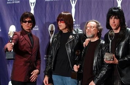 In this March 18, 2002 photo members of the Ramones, from left to right, Dee Dee, Johnny, Tommy and Marky Ramone hold their awards after being inducted at the Rock and Roll Hall of Fame.
